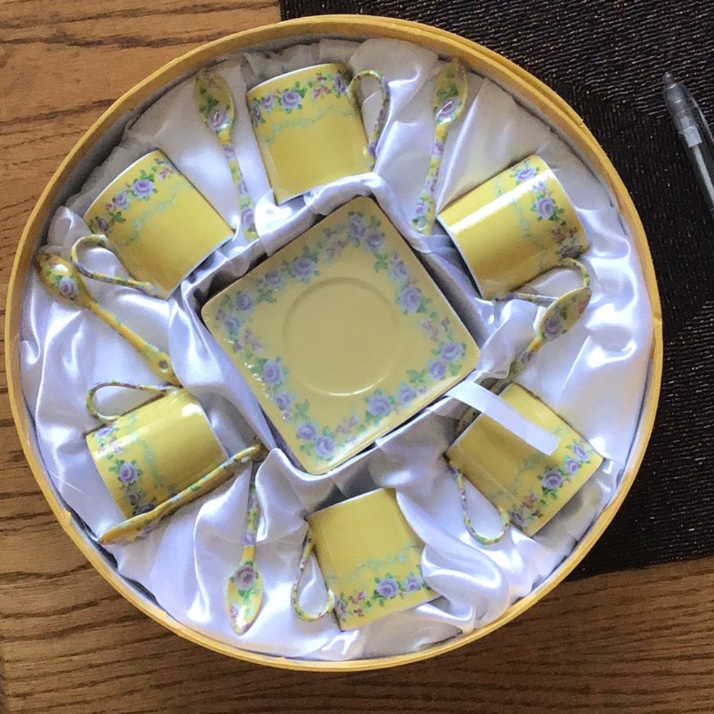 Set of espresso cups, saucers, and spoons